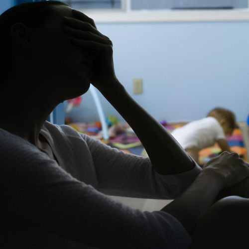 money jar on its side with coins spilling out