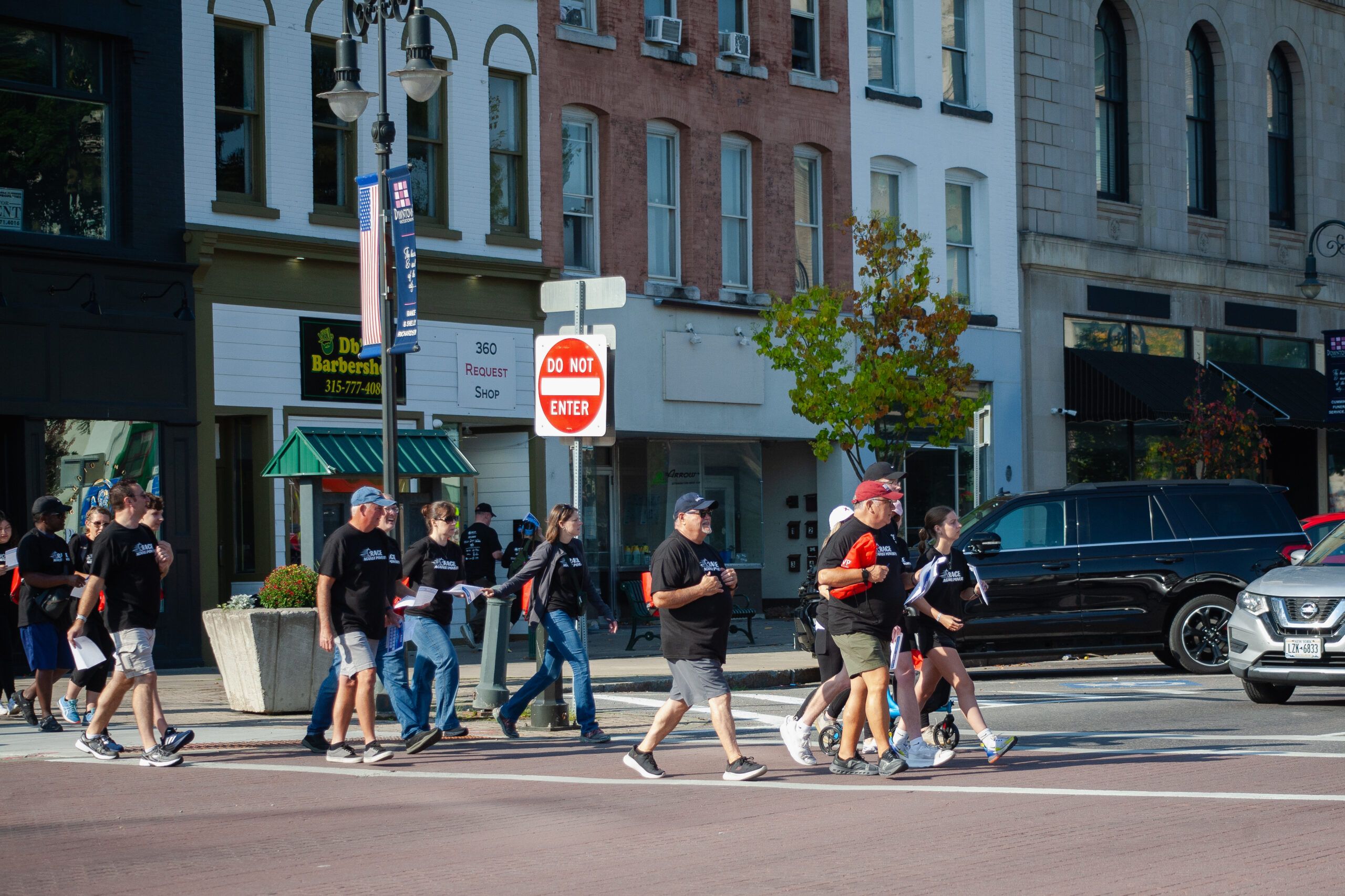 The Muleskinners MC pose with their bikes while volunteering at the Race Against Poverty