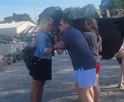 Image of flyer promoting Cow Kissing for ALICE with cow in center wearing a bib with United Way logo