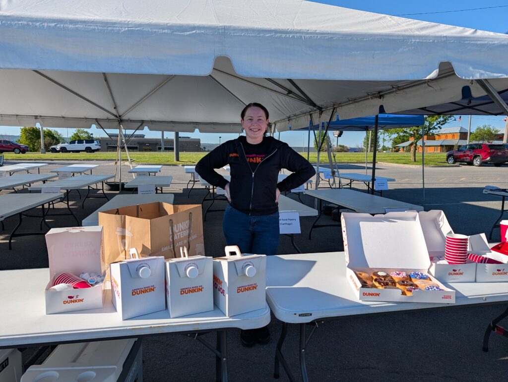 Dunkin Donuts stops by with coffee and donuts for the volunteers.