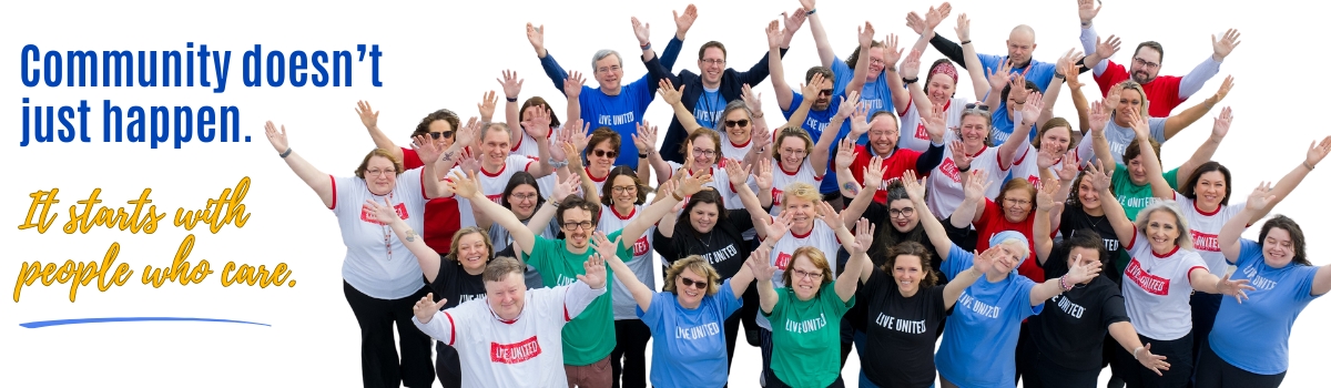 Group of people with hands in air, all wearing LIVE UNITED t-shirts. Campaign theme "Community doesn't just happen. It starts with people who care."