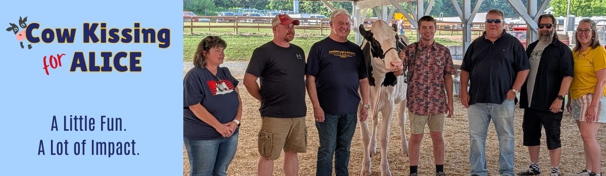 Group of people lined up with cow from Rossdale Farm