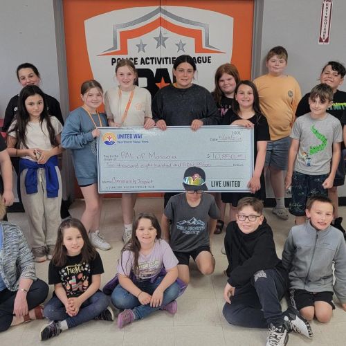 group of children holding large United Way check
