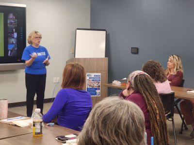 United Way CEO speaking to a group as part of the workplace campaign