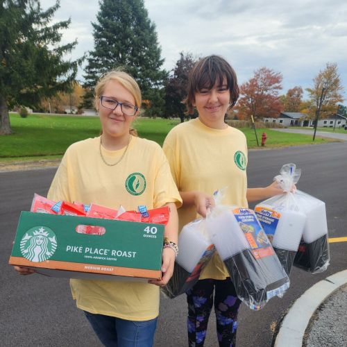 smiling people holding various food related items