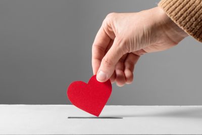 Hand with a cardboard heart image